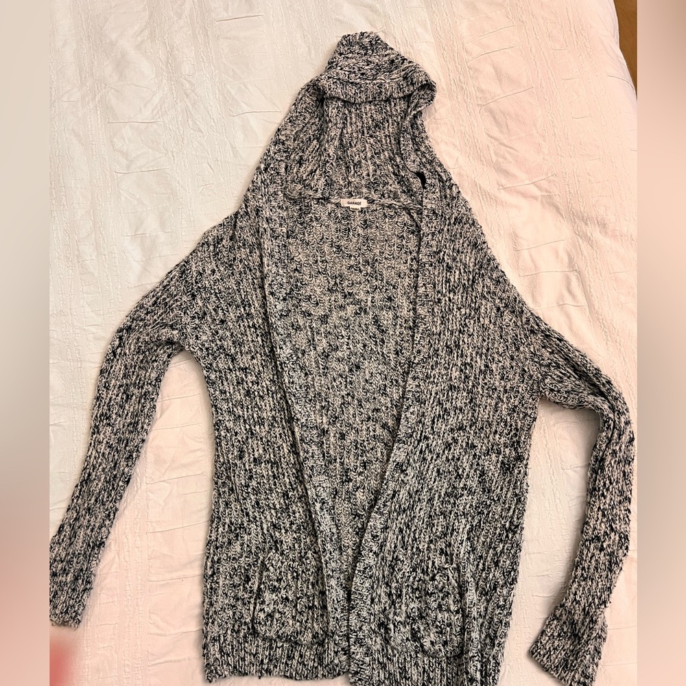 Black and white knit sweater with hood size. Size M/L